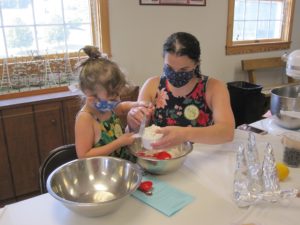 Mother and Daughter measuring flour