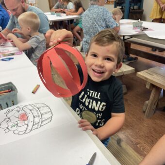 Children with apple craft