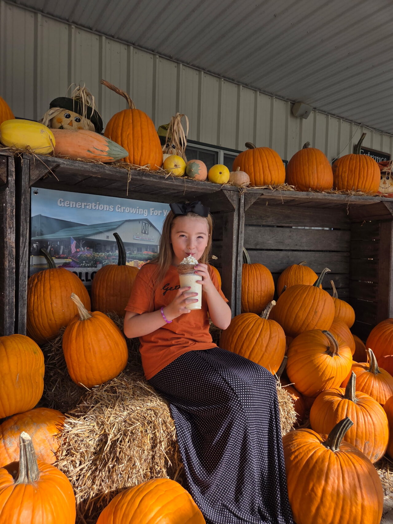 Young girl drinking apple cider donut milkshake.